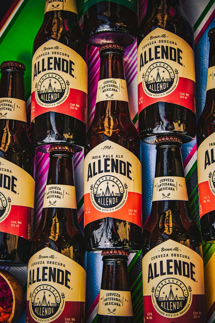 Services Close-up of vibrant Mexican Allende beer bottles arranged artistically in Mexico City.
